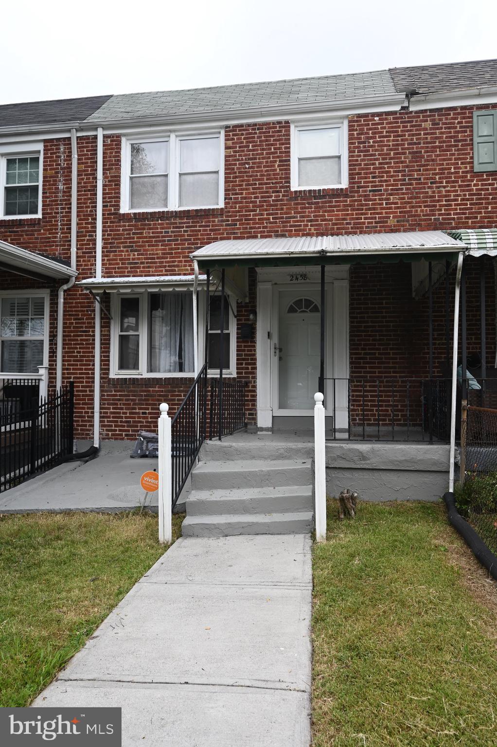 2458 Nevada Street Baltimore, MD 21230 - Photo 19 of 19 a view of a house with a yard balcony and large tree