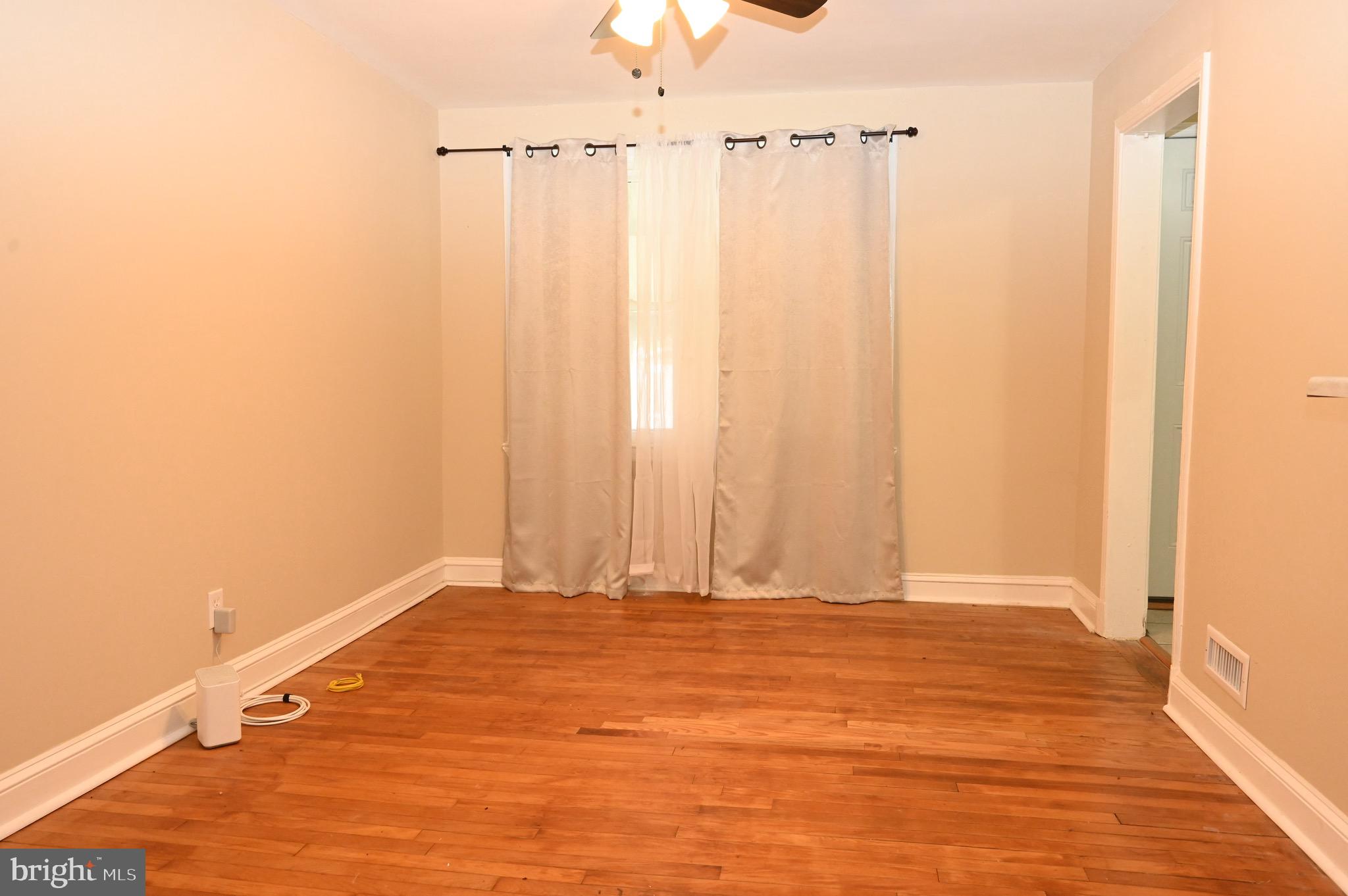2458 Nevada Street Baltimore, MD 21230 - Photo 4 of 19 a view of a room with wooden floor