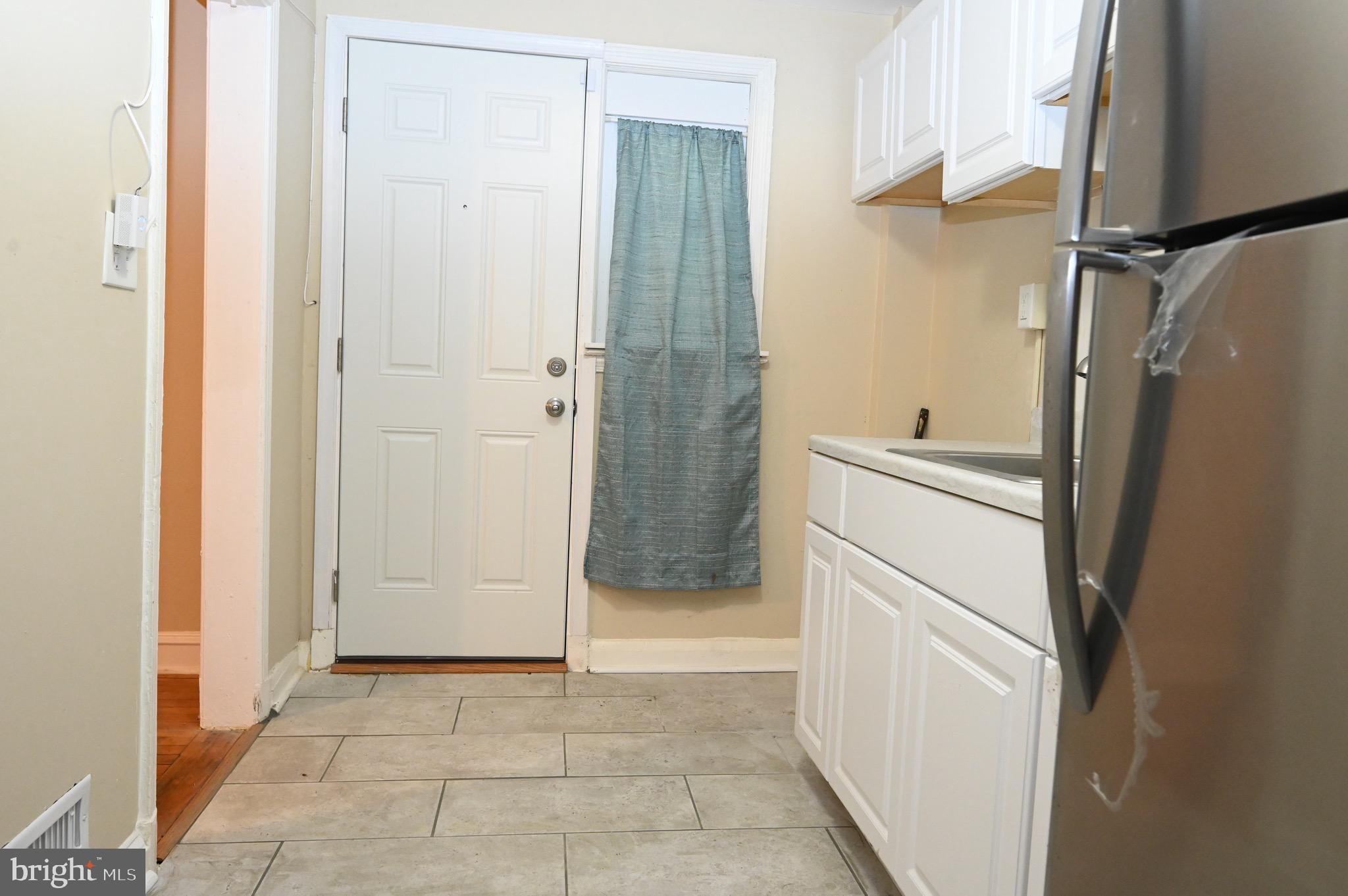 2458 Nevada Street Baltimore, MD 21230 - Photo 6 of 19 a bathroom with a shower and a sink