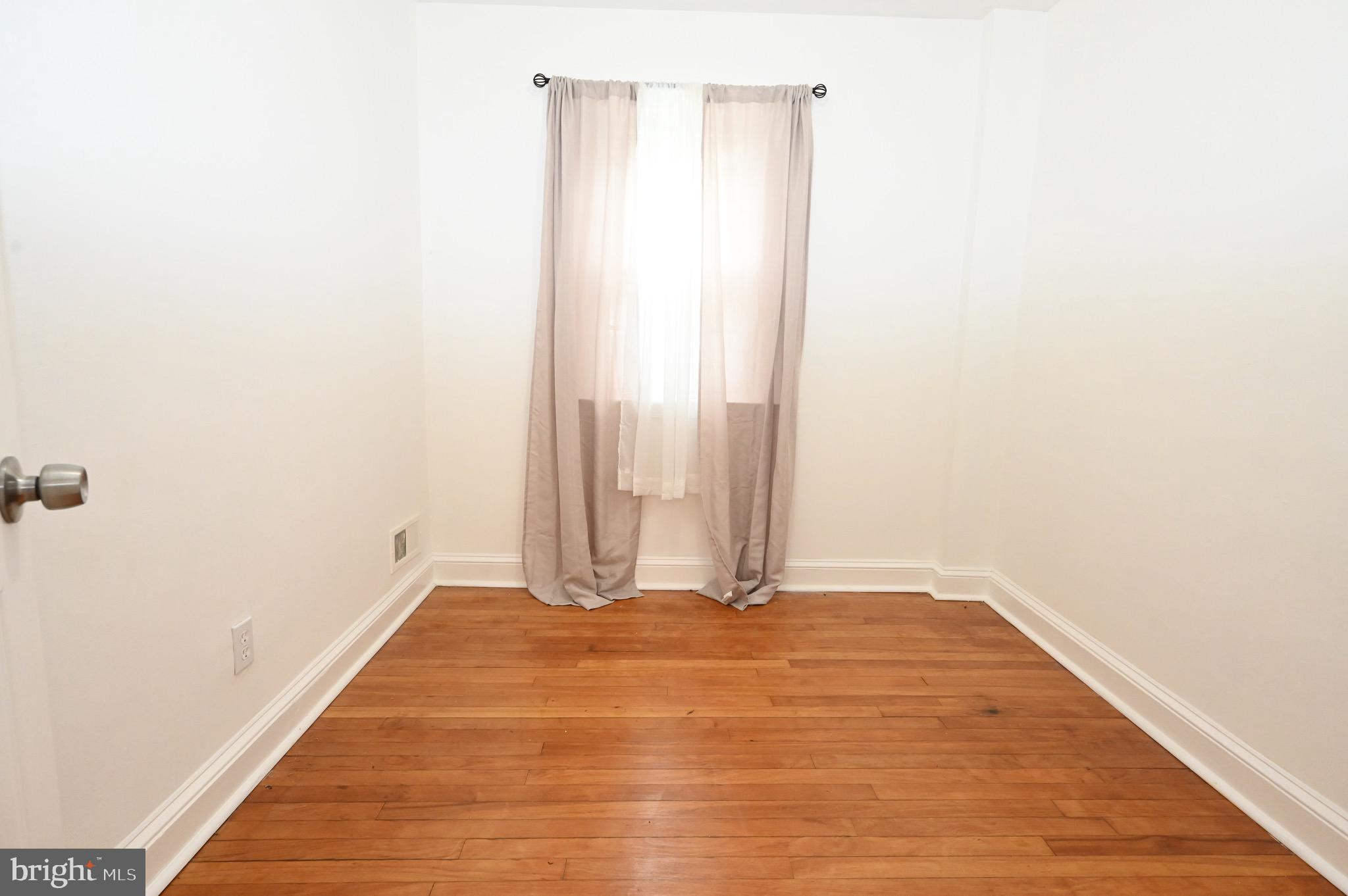 2458 Nevada Street Baltimore, MD 21230 - Photo 9 of 19 a view of a room with wooden floor
