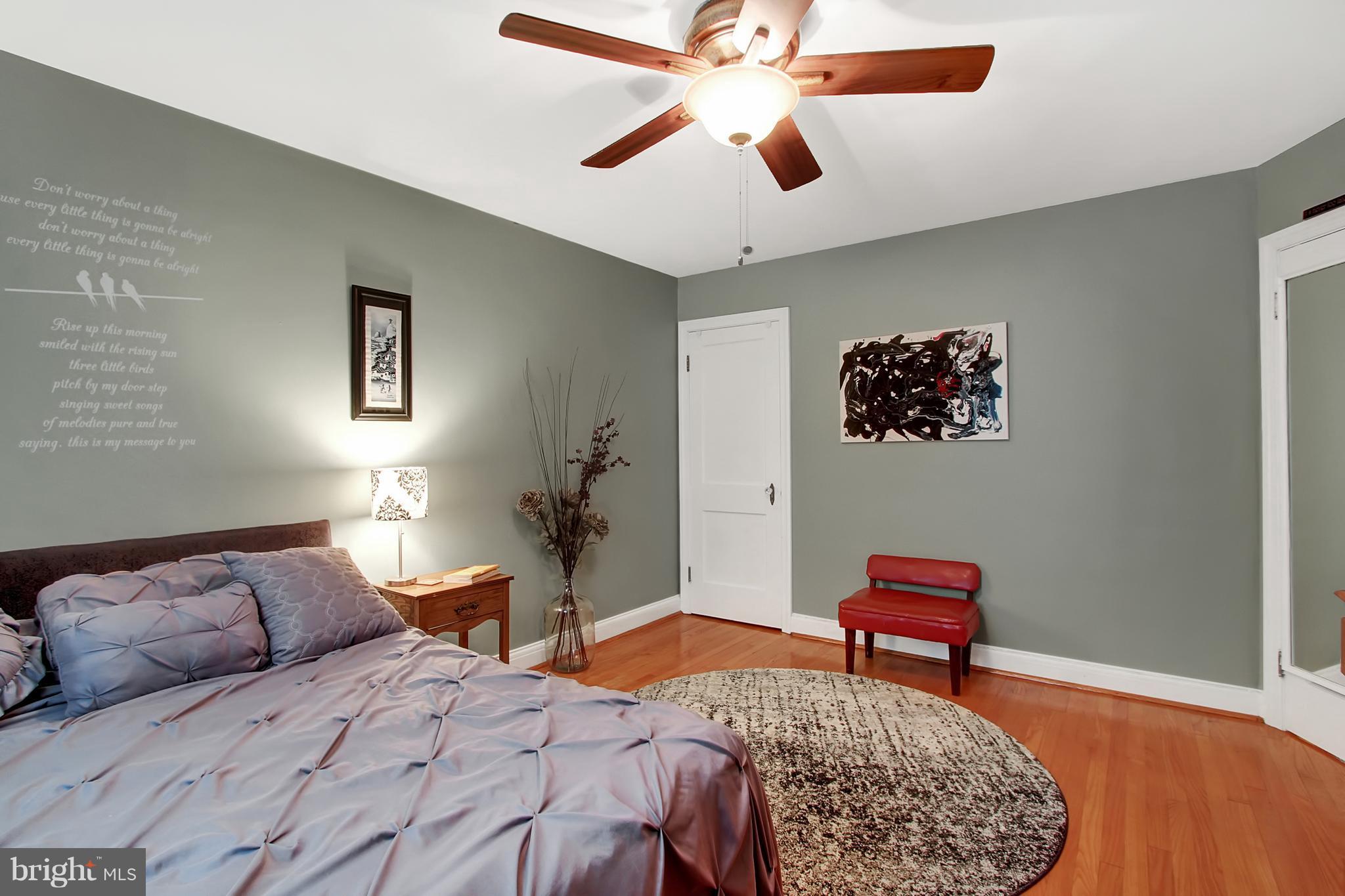 3605 Ednor Road Baltimore, MD 21218 - Photo 14 of 23 a bedroom with bed and a chandelier