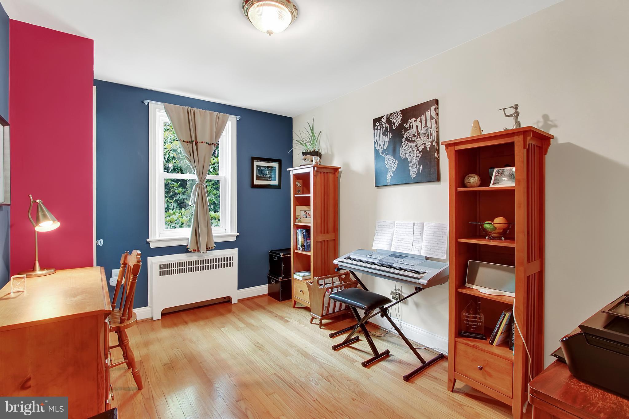3605 Ednor Road Baltimore, MD 21218 - Photo 15 of 23 a view of a workspace with furniture and a window