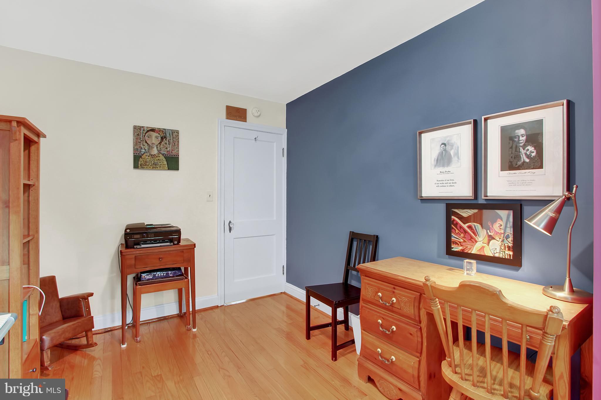3605 Ednor Road Baltimore, MD 21218 - Photo 16 of 23 a bedroom with furniture and a wooden floor