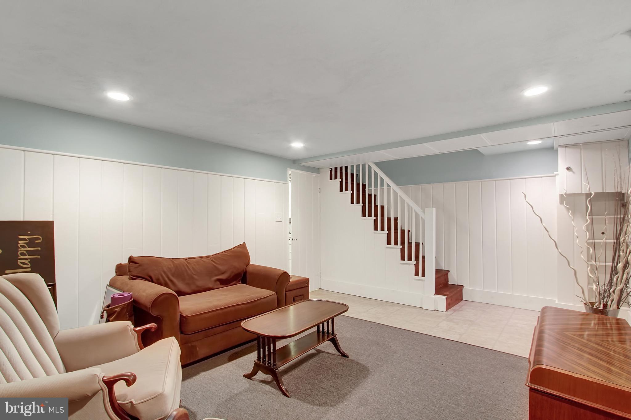 3605 Ednor Road Baltimore, MD 21218 - Photo 20 of 23 a living room with furniture and a potted plant