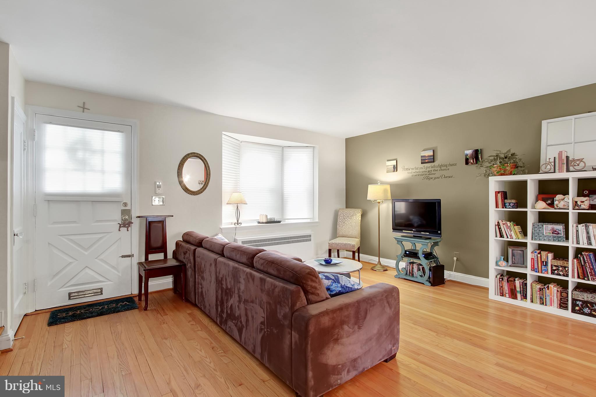 3605 Ednor Road Baltimore, MD 21218 - Photo 4 of 23 a living room with furniture and a flat screen tv