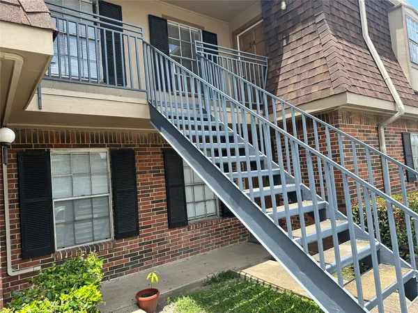 a balcony view with staircase