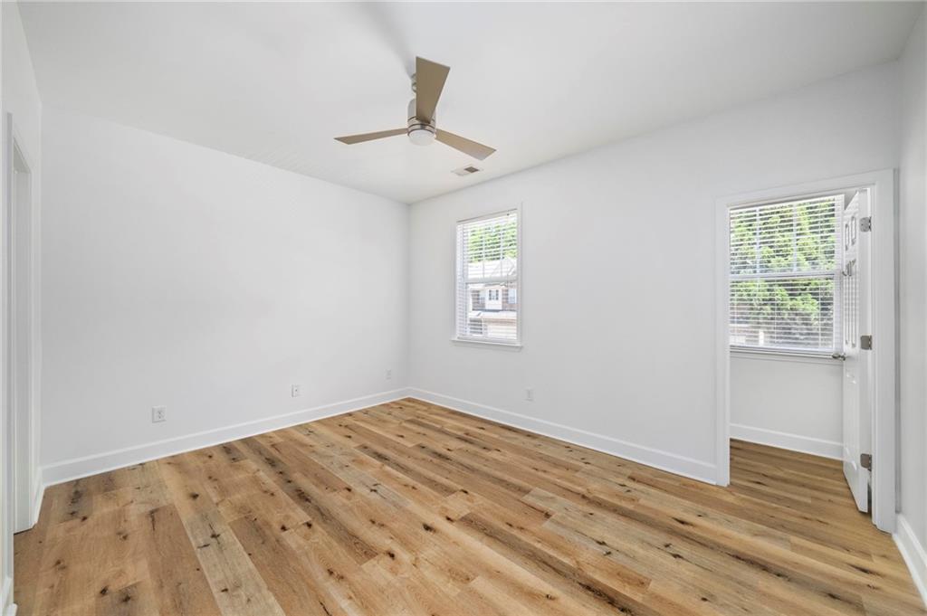 3628 Ashcroft Bend Atlanta, GA 30319 - Photo 36 of 44 wooden floor in an empty room with a window