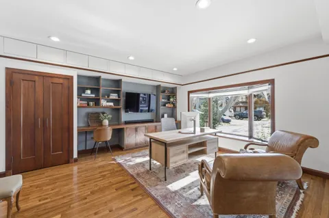 a living room with furniture and large window