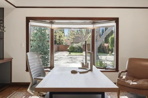 a workspace with furniture and a window