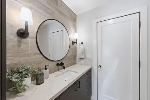 a bathroom with a sink and a mirror