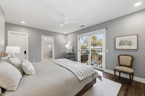 a bedroom with a bed chair and window