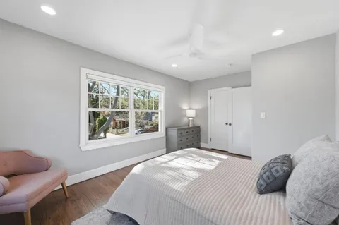 a bedroom with a bed and a couch