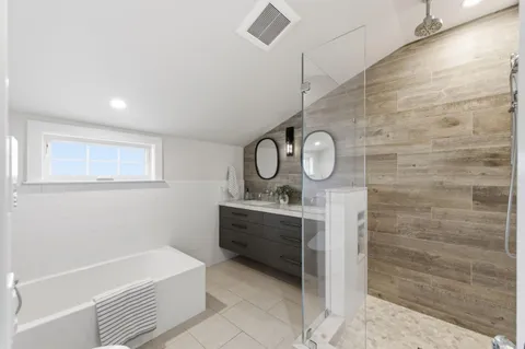 a bathroom with a sink a bathtub and a shower