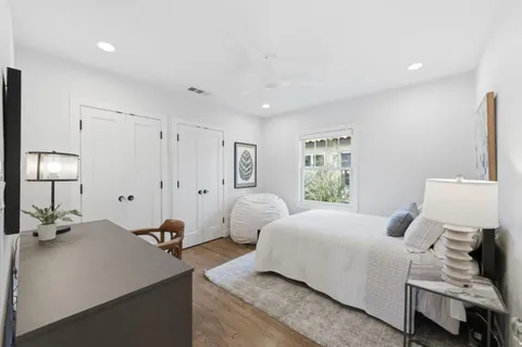 a bedroom with a bed and a lamp