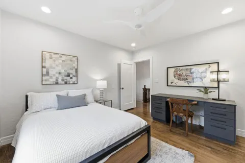 a bedroom with a large bed and a furniture