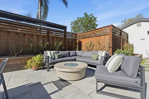 a outdoor living space with furniture and a potted plant
