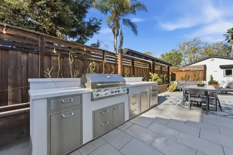 a kitchen with a stove and cabinets