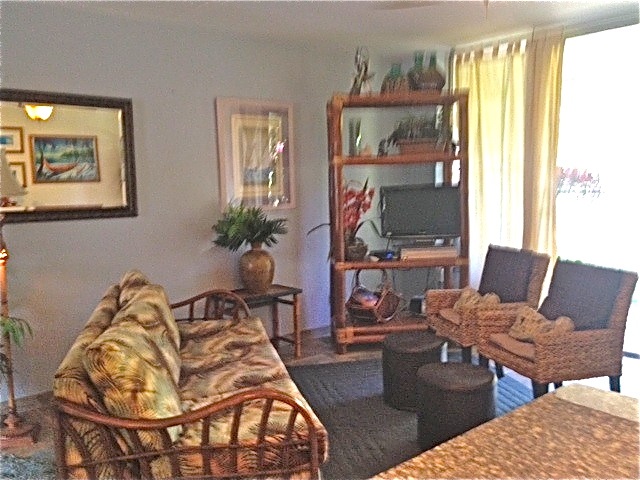 2495 South Kihei Road, Unit 153 Kihei, HI 96753 - Photo 4 of 11 a living room with furniture a window and a flat screen tv