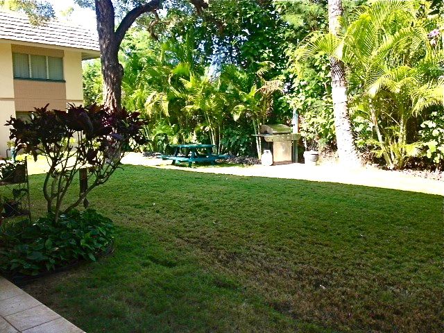 2495 South Kihei Road, Unit 153 Kihei, HI 96753 - Photo 8 of 11 a view of yard with swimming pool and green space