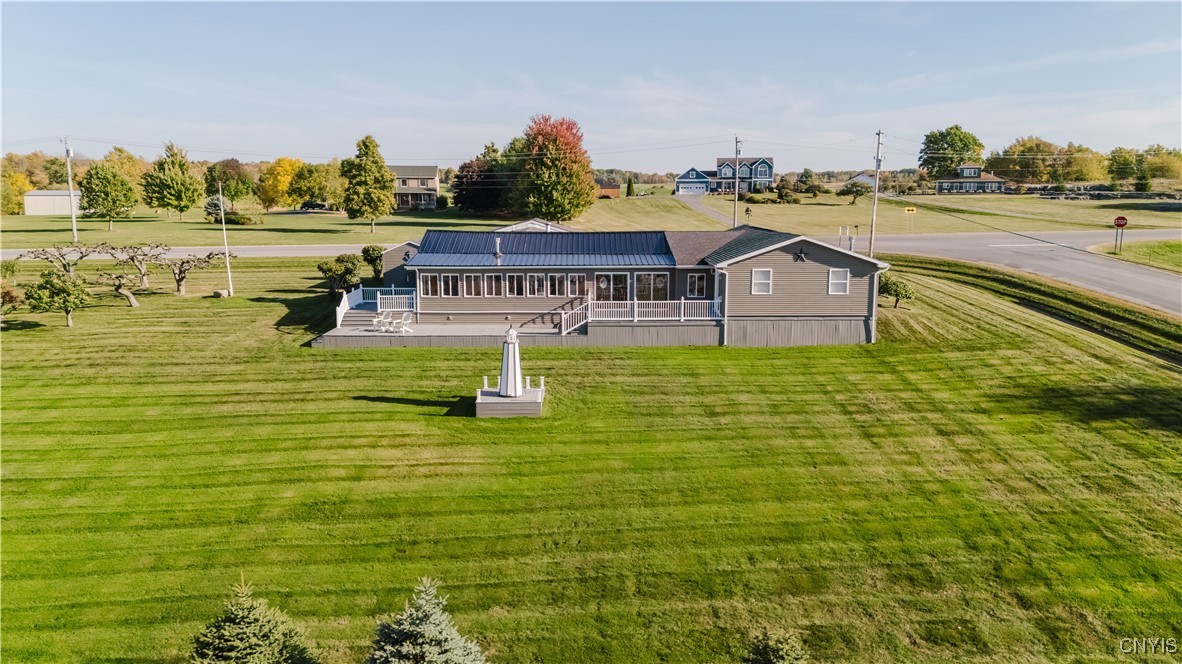 35303 State Rte Cape Cape Vincent, NY 13618 - Photo 40 of 44 view of the river facing side of house with deck a