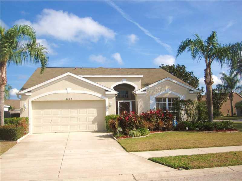 4635 Sanibel Way Bradenton, FL 34203 - Photo 1 of 1 a front view of a house with garden