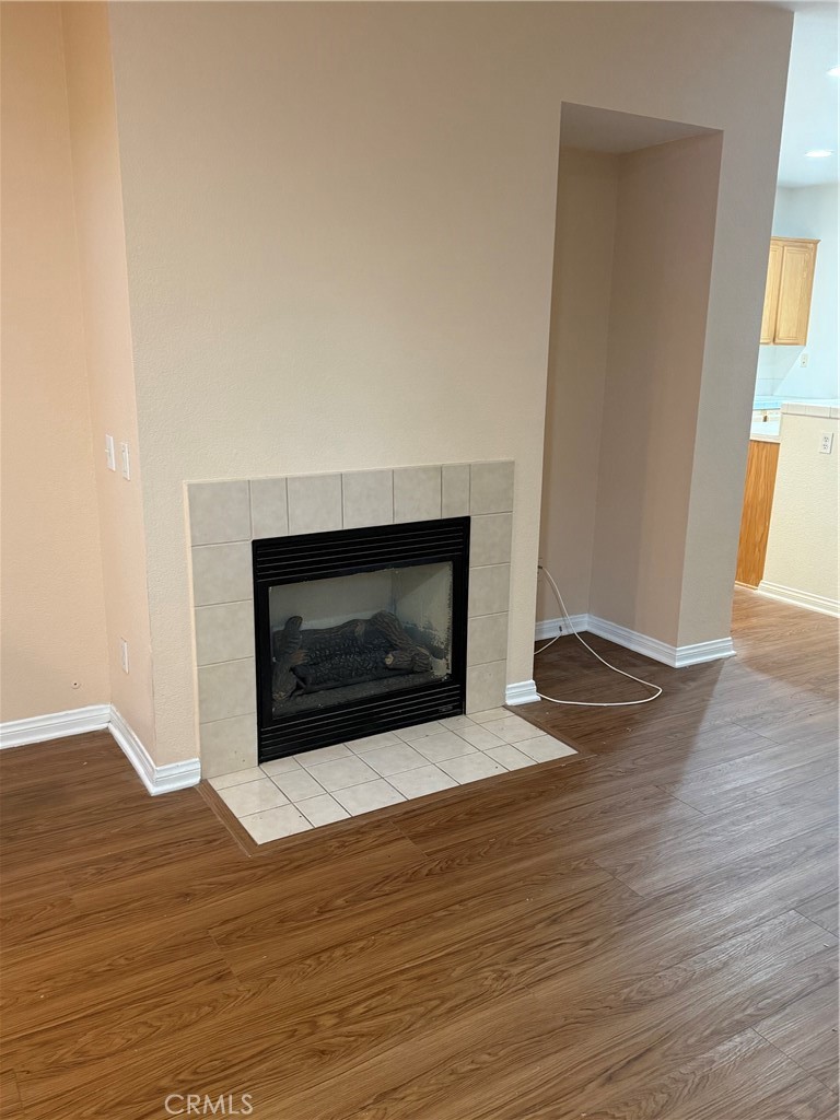 4420 Kristen Court Riverside, CA 92501 - Photo 8 of 39 GAS LOG FIRELACE WITH LIGHT SWITCH ON WALL TO THE TOP LEFT