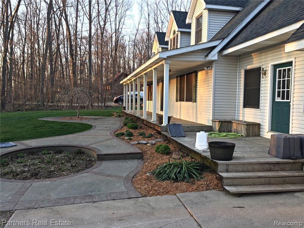 5371 Dutton Road Gregory, MI 48137 - Photo 65 of 72 This fall season photo really shows off the winding stamped concrete walkway.
