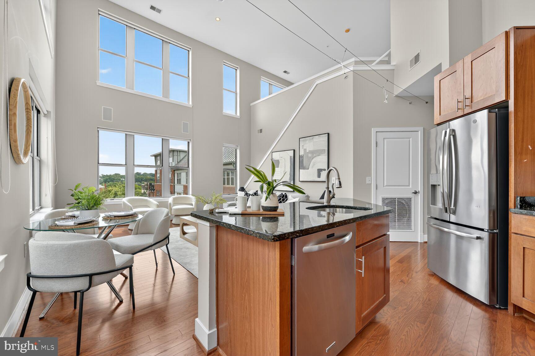 1800 Wilson Boulevard, Unit 449 Arlington, VA 22201 - Photo 17 of 99 a kitchen with stainless steel appliances granite countertop a sink stove and refrigerator