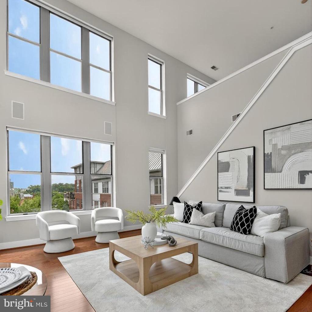 1800 Wilson Boulevard, Unit 449 Arlington, VA 22201 - Photo 24 of 99 a living room with furniture and a large window