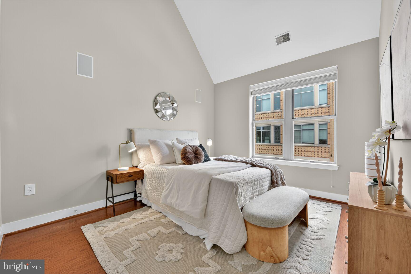 1800 Wilson Boulevard, Unit 449 Arlington, VA 22201 - Photo 34 of 99 a bedroom with bed and a window