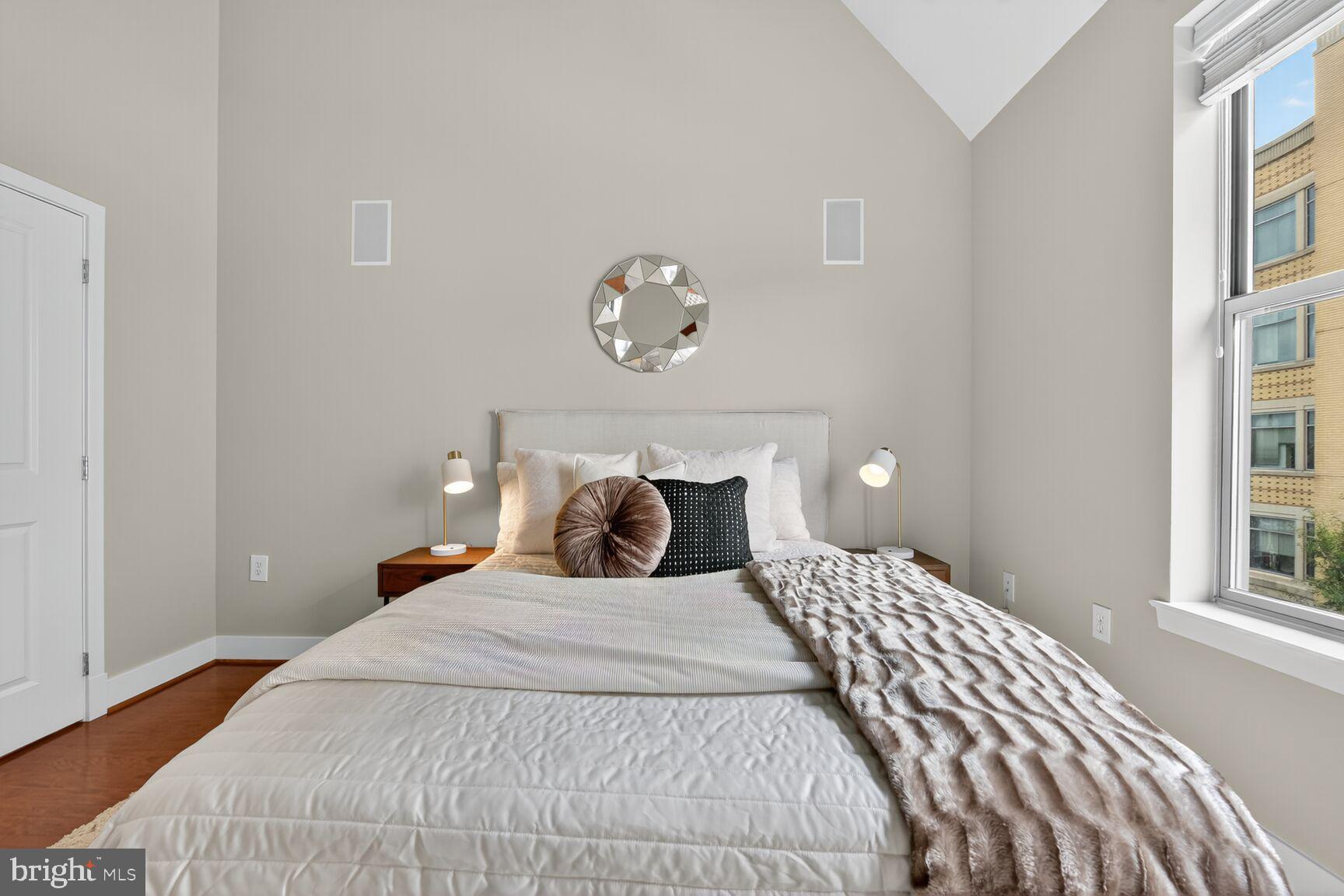 1800 Wilson Boulevard, Unit 449 Arlington, VA 22201 - Photo 35 of 99 a bedroom with a bed and a window