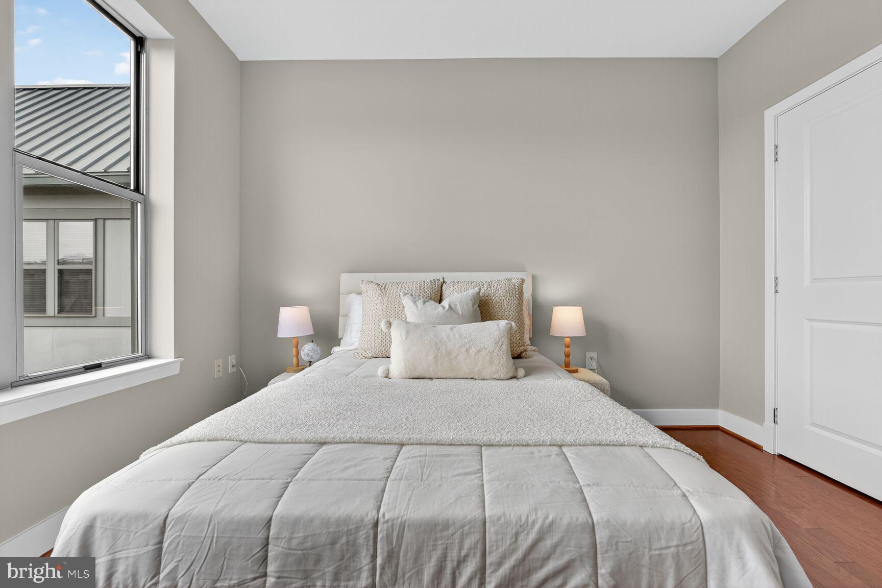 1800 Wilson Boulevard, Unit 449 Arlington, VA 22201 - Photo 51 of 99 a bedroom with a bed and window