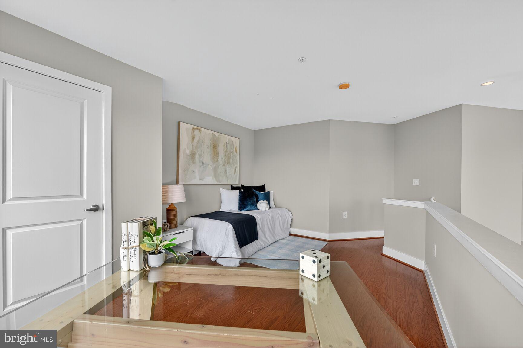 1800 Wilson Boulevard, Unit 449 Arlington, VA 22201 - Photo 66 of 99 a view of kitchen island with furniture and wooden floor