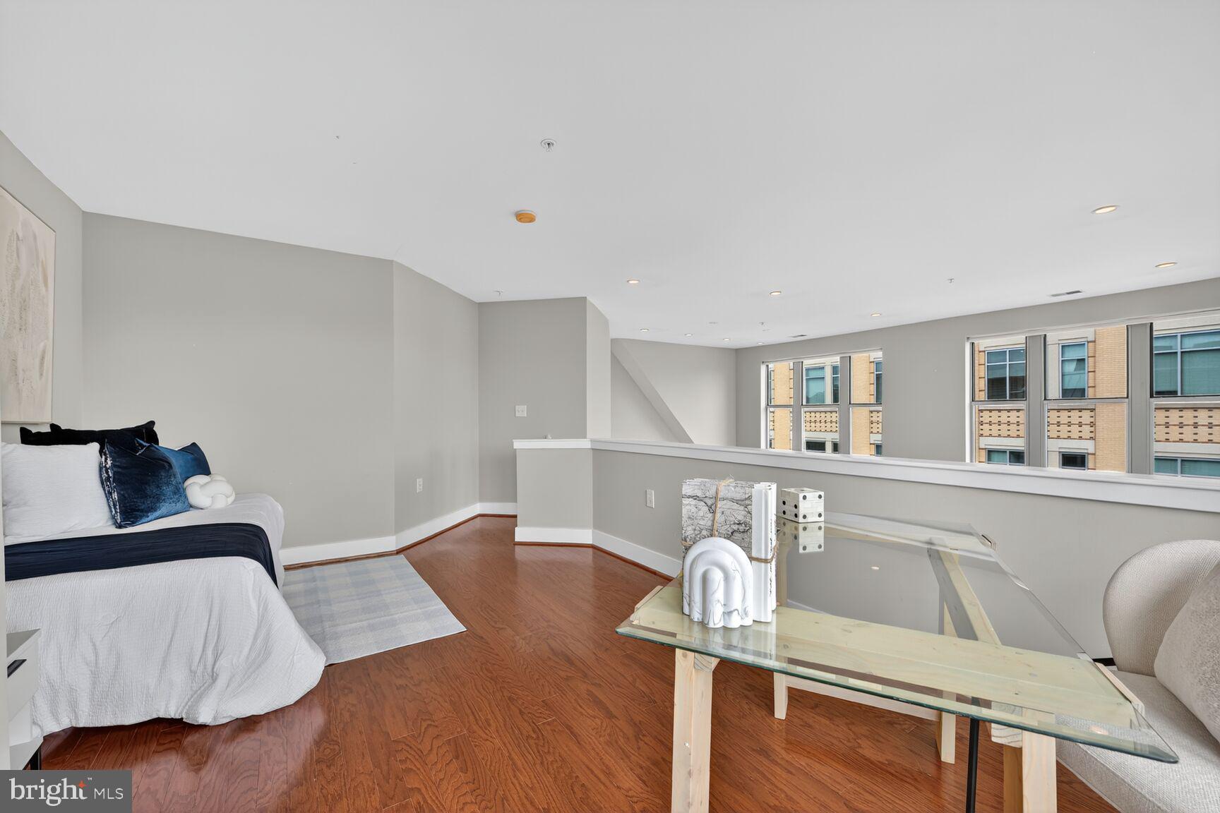 1800 Wilson Boulevard, Unit 449 Arlington, VA 22201 - Photo 67 of 99 a living room with furniture and wooden floor