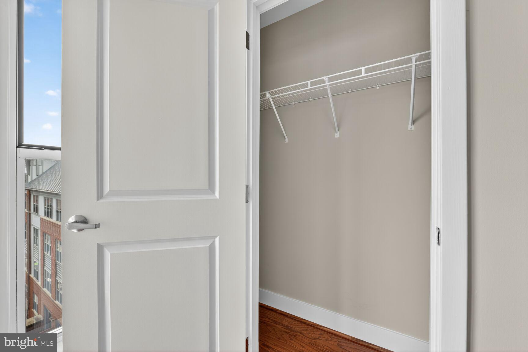 1800 Wilson Boulevard, Unit 449 Arlington, VA 22201 - Photo 68 of 99 a bathroom with a glass shower door