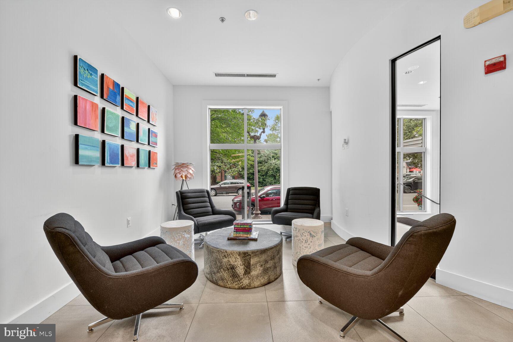 1800 Wilson Boulevard, Unit 449 Arlington, VA 22201 - Photo 70 of 99 a living room with furniture and a large window