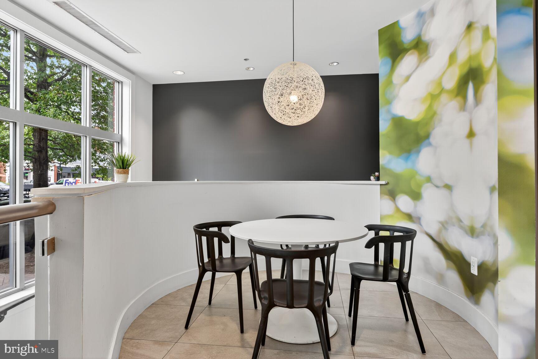 1800 Wilson Boulevard, Unit 449 Arlington, VA 22201 - Photo 73 of 99 a view of a dining area with furniture and a large window