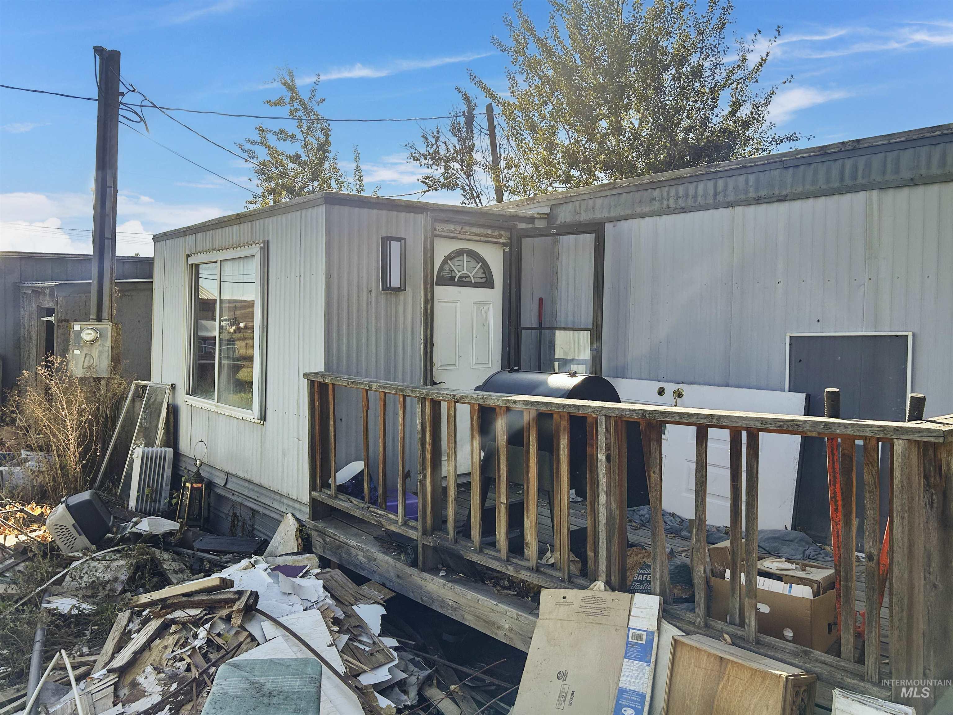 Entrance to property featuring a deck