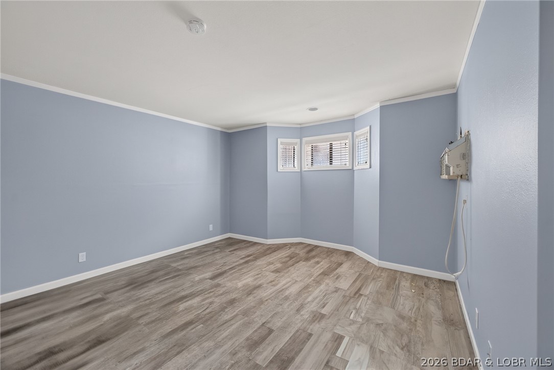 1111 Passover Road, Unit N1 Osage Beach, MO 65065 - Photo 47 of 57 Large guest bedroom with updated flooring.