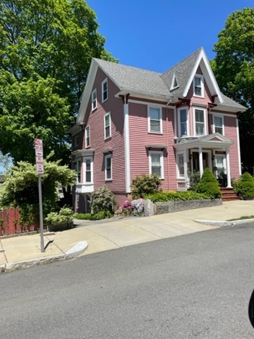 35 Broadway, Unit 2 Beverly, MA 01915 - Photo 1 of 1 a front view of a house with a yard