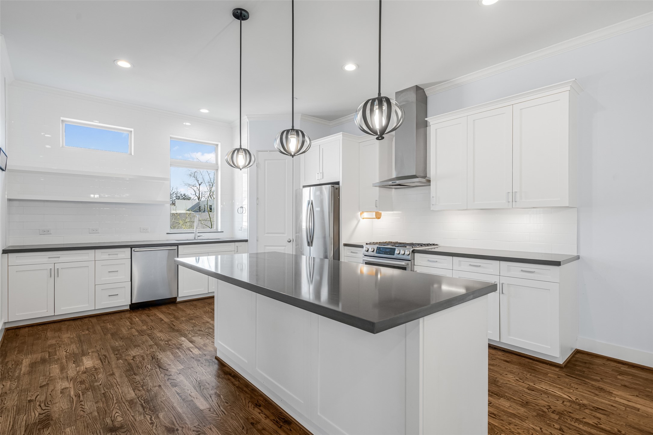2324 Camden Drive, Unit C Houston, TX 77021 - Photo 12 of 34 a kitchen with stainless steel appliances a large counter space a sink and a refrigerator