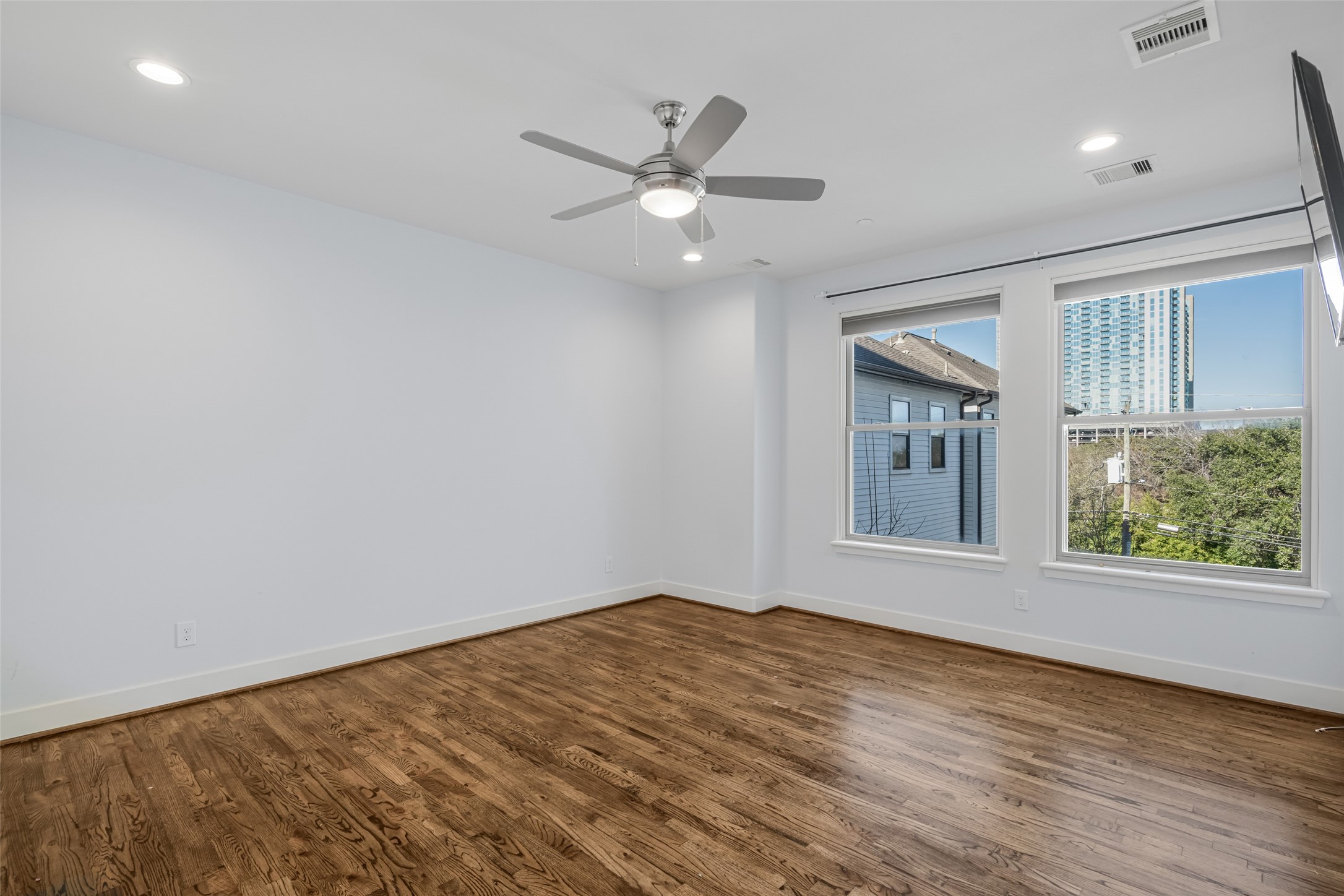 2324 Camden Drive, Unit C Houston, TX 77021 - Photo 16 of 34 wooden floor in an empty room with a window