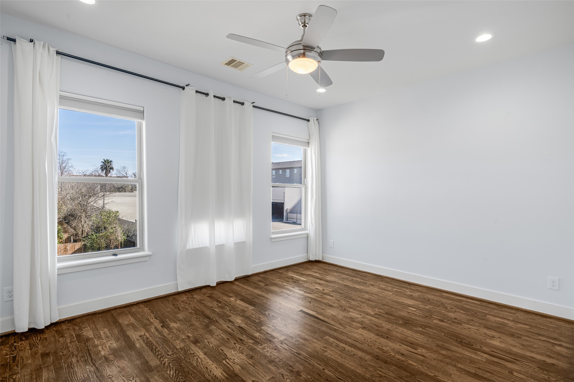 2324 Camden Drive, Unit C Houston, TX 77021 - Photo 21 of 34 a view of empty room with wooden floor and fan