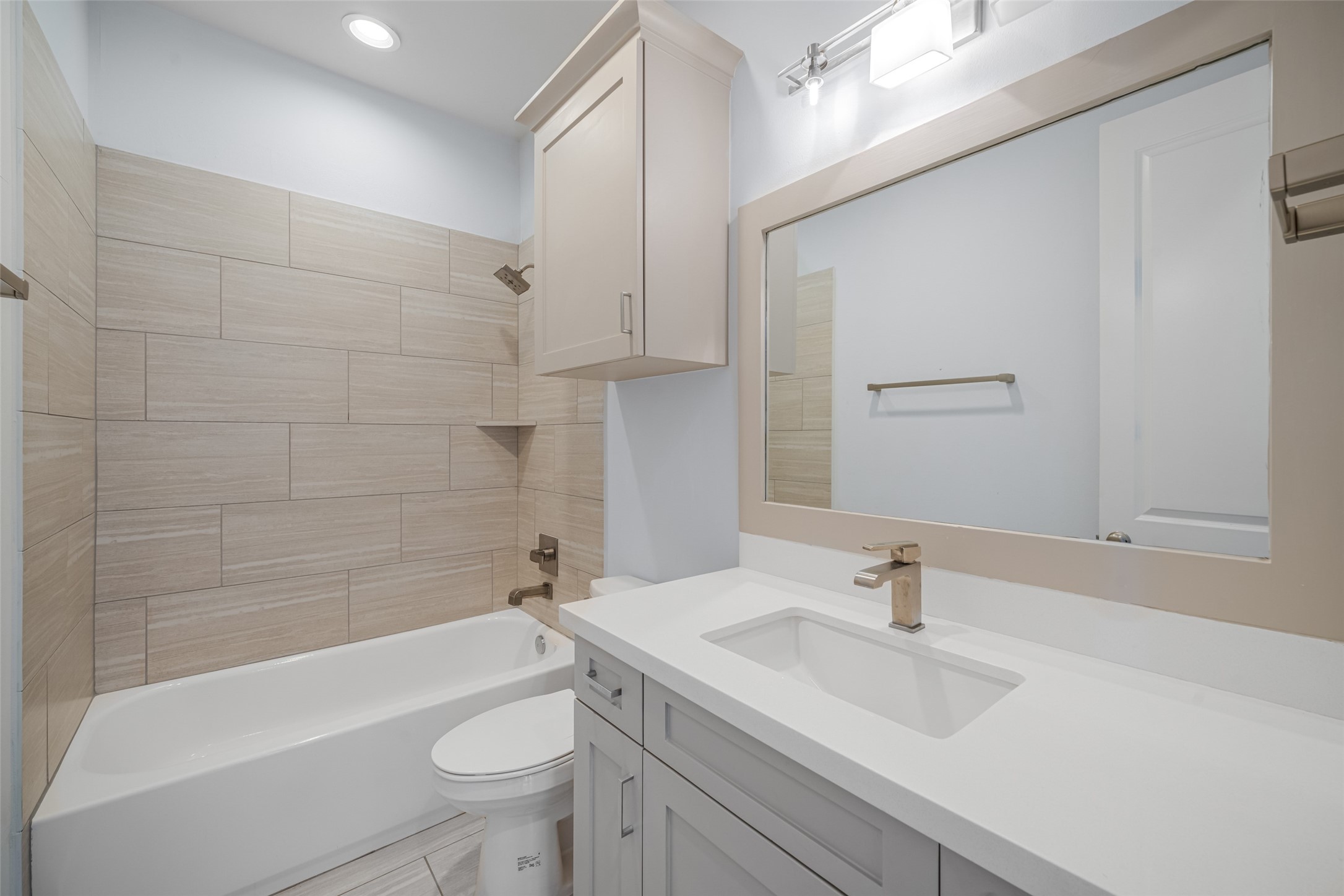 2324 Camden Drive, Unit C Houston, TX 77021 - Photo 24 of 34 a bathroom with a sink a toilet and shower