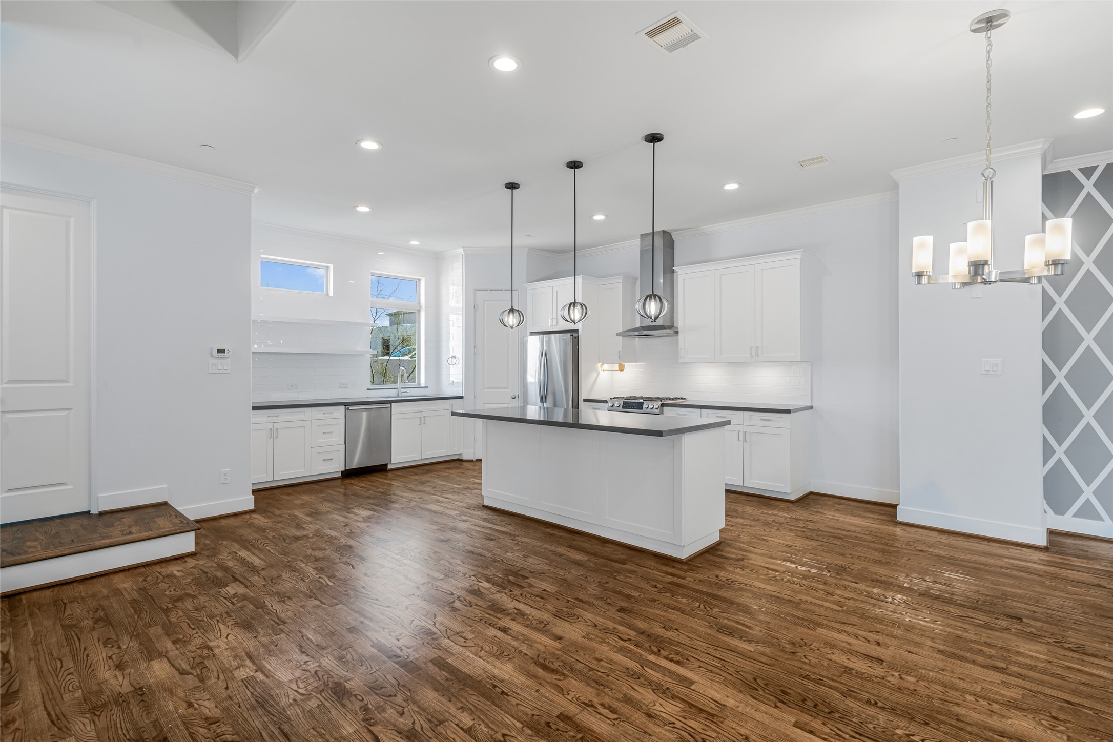 2324 Camden Drive, Unit C Houston, TX 77021 - Photo 8 of 34 a kitchen with stainless steel appliances kitchen island hardwood floor sink and stove