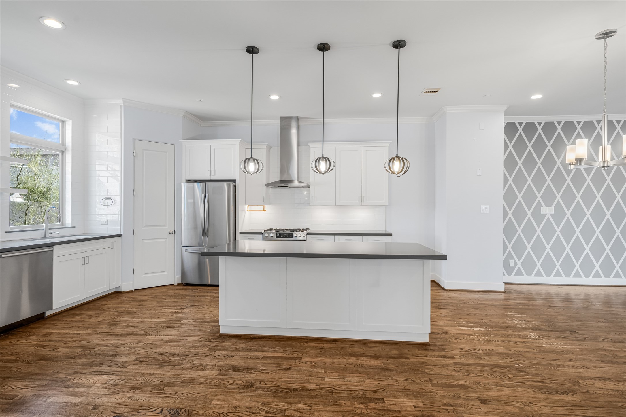 2324 Camden Drive, Unit C Houston, TX 77021 - Photo 10 of 34 a kitchen with stainless steel appliances granite countertop a sink a stove and a wooden floors