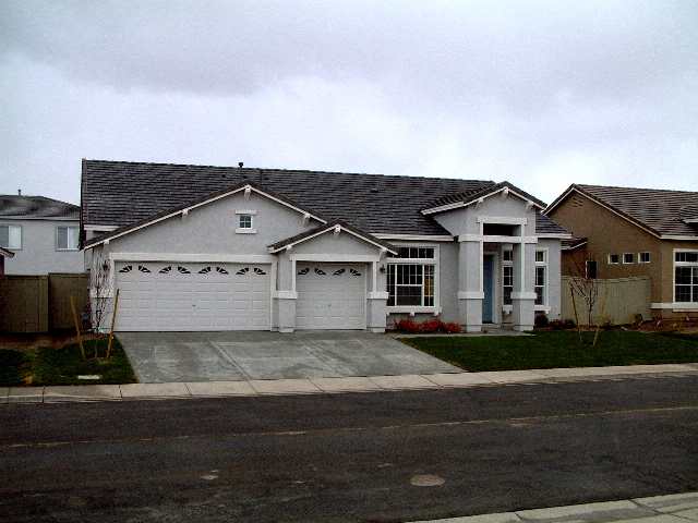 1621 Caliterra Way Reno, NV 89521 - Photo 1 of 4 front view of house with a yard