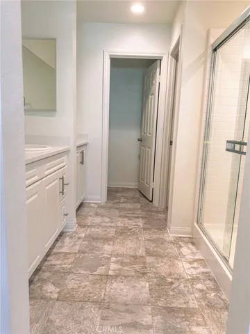 a view of a bathroom with a sink and a mirror