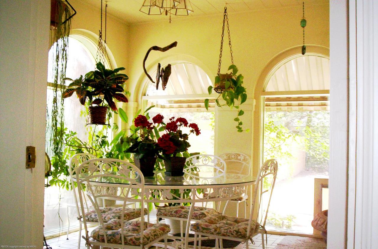 2011 3rd Avenue Canyon, TX 79015 - Photo 13 of 15 a vase of flowers sitting on a table with painted walls