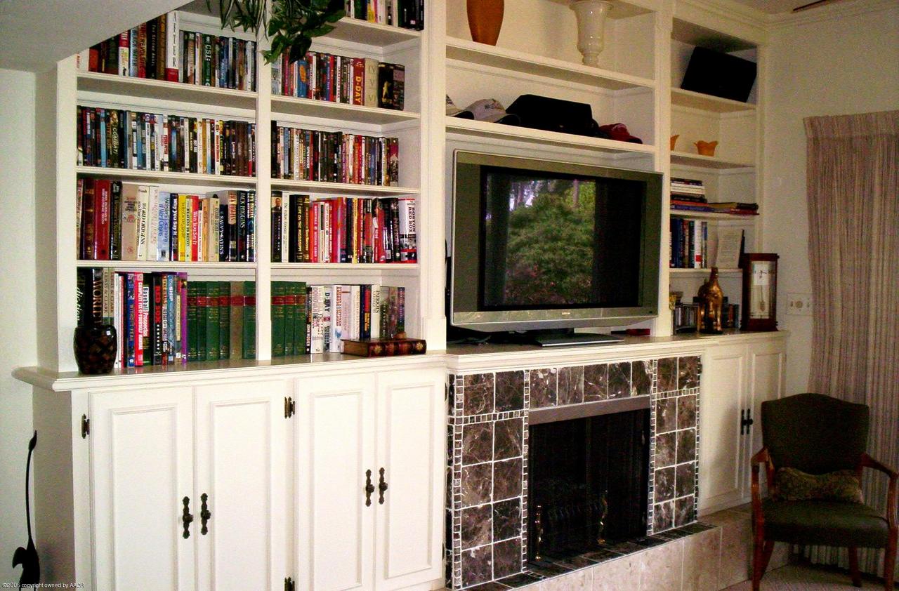 2011 3rd Avenue Canyon, TX 79015 - Photo 6 of 15 a living room with a fireplace and a book shelf